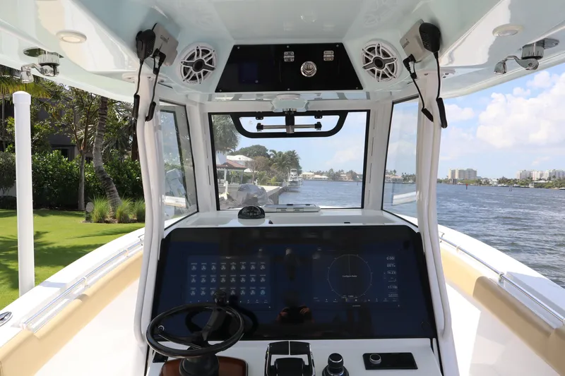 Slide: The Image of 2025 Sportsman Open 322 Center Console boat interior with advanced navigation system. - 12