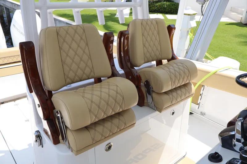 Slide: The Image of 2025 Sportsman Open 322 Center Console with luxurious beige seating. - 14