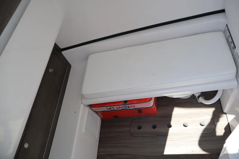 Slide: The Image of 2025 Sportsman Open 322 Center Console interior with seating and life jackets storage. - 17