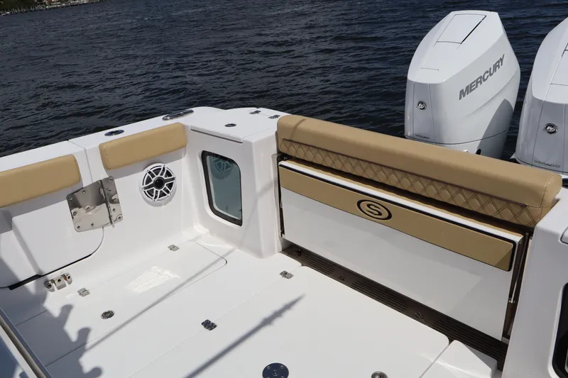 Slide: The Image of 2025 Sportsman Open 322 Center Console boat with Mercury engines on water. - 18