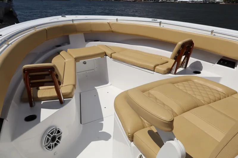 Slide: The Image of Luxurious seating on 2025 Sportsman Open 322 Center Console boat, featuring tan upholstery. - 4