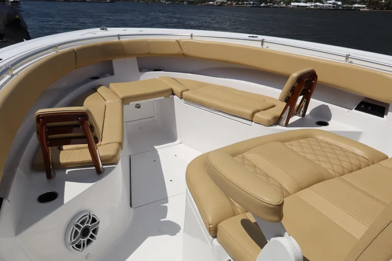 Slide: The Image of Luxurious seating on 2025 Sportsman Open 322 Center Console boat, featuring tan upholstery. - 5