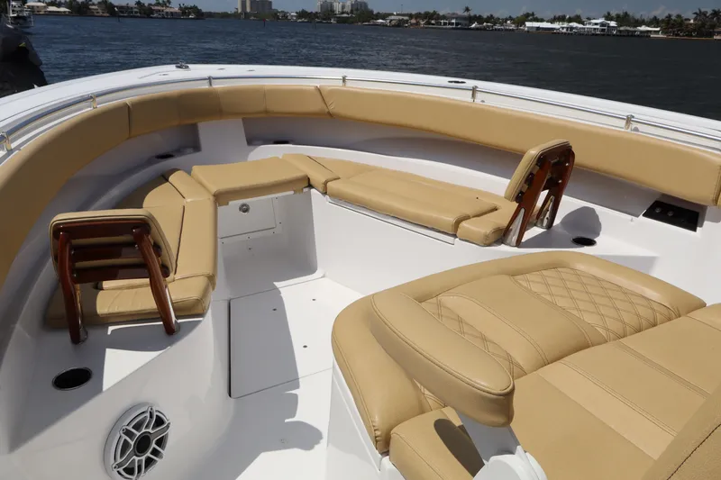 Slide: The Image of 2025 Sportsman Open 322 Center Console boat with tan seating and ocean view. - 6