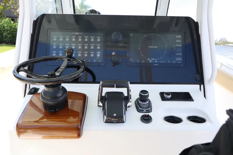 Slide: The Image of 2025 Sportsman Open 322 Center Console dashboard with advanced navigation controls and displays. - 9