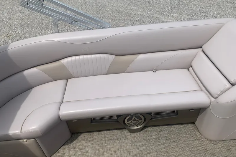 Slide: The Image of Luxurious seating on a 2015 Avalon Windjammer Elite 25' pontoon boat, featuring plush upholstery. - 6