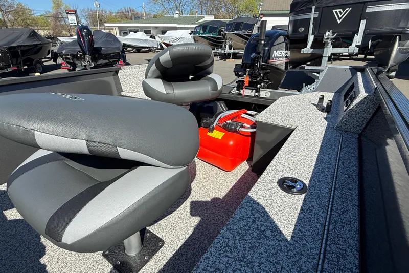 Slide: The Image of 2020 MirroCraft 1415 Outfitter boat interior with seating and Mercury outboard motor. - 3