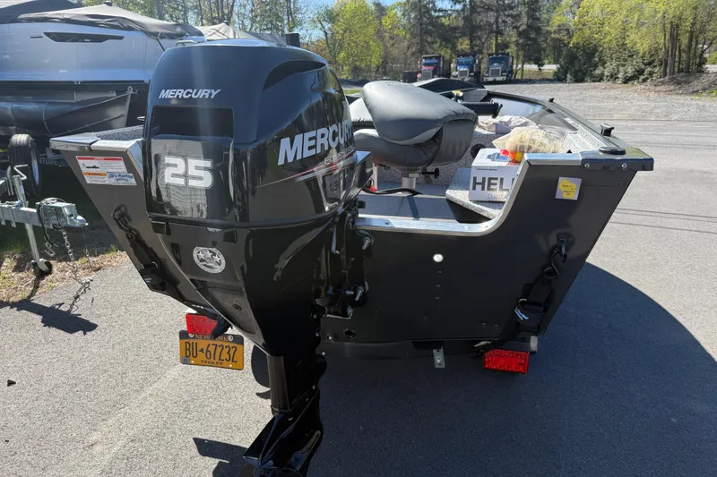 Slide: The Image of 2020 MirroCraft 1415 Outfitter boat with Mercury 25 horsepower engine on trailer. - 8