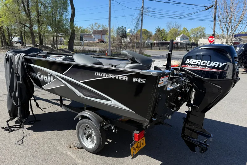 Slide: The Image of 2020 MirroCraft 1415 Outfitter boat with Mercury FourStroke engine on a trailer. - 9