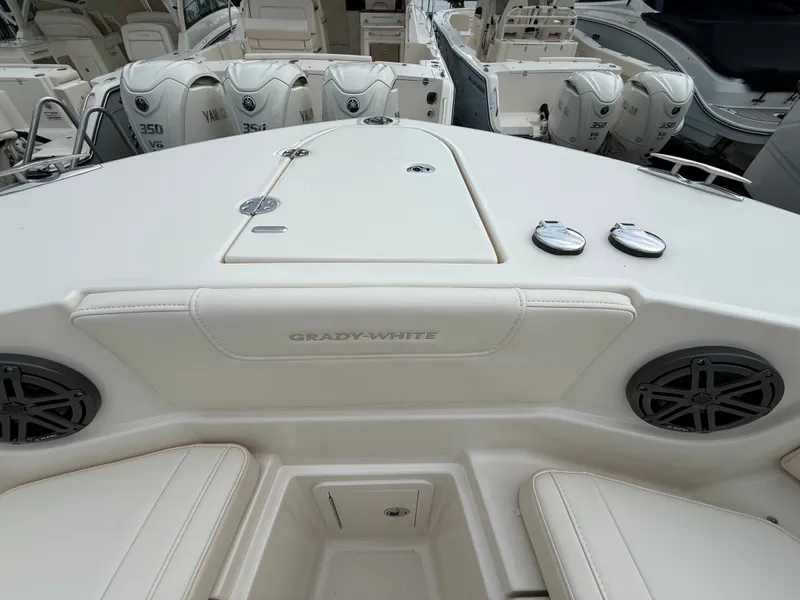 Slide: The Image of The image shows the cockpit of a Grady-White Canyon 266 boat with speakers and storage. - 15