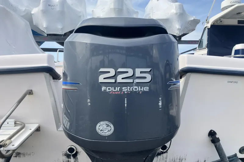 Slide: The Image of Outboard motor on a 1998 Grady-White Seafarer 226 boat, featuring a 225 Four Stroke engine. - 10
