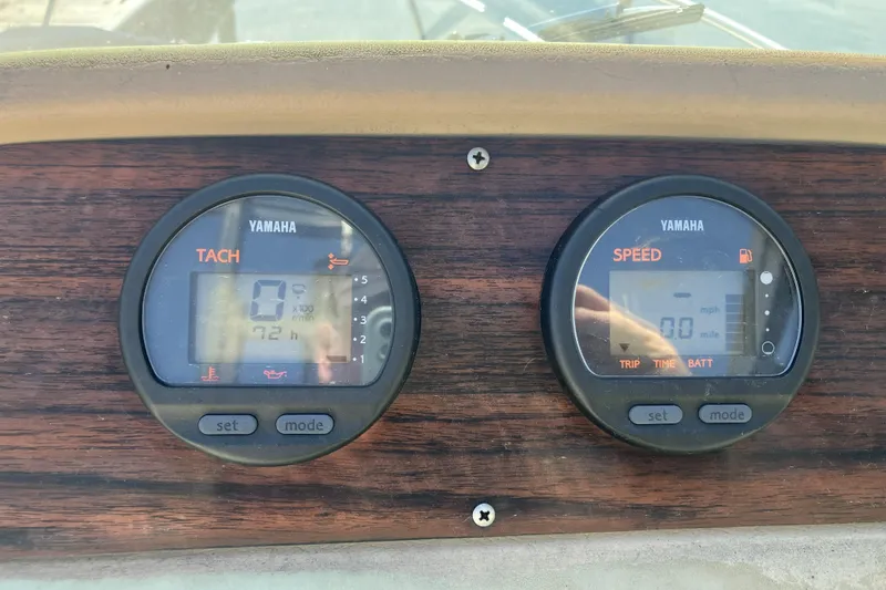 Slide: The Image of Yamaha tachometer and speedometer on 1998 Grady-White Seafarer 226 boat dashboard. - 19