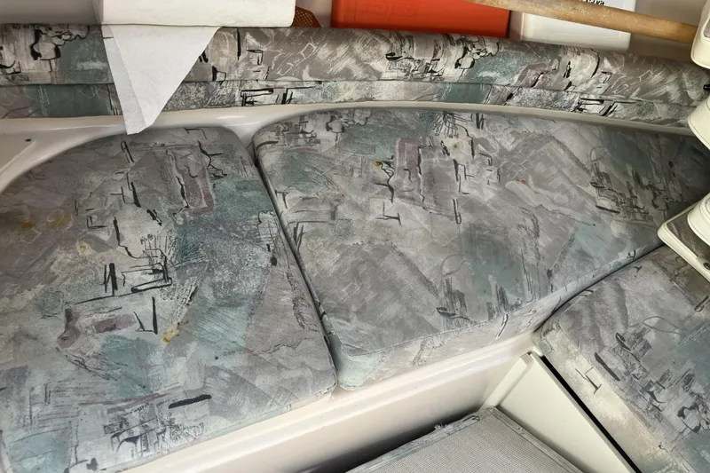 Slide: The Image of Interior seating of a 1998 Grady-White Seafarer 226 boat with patterned upholstery. - 26