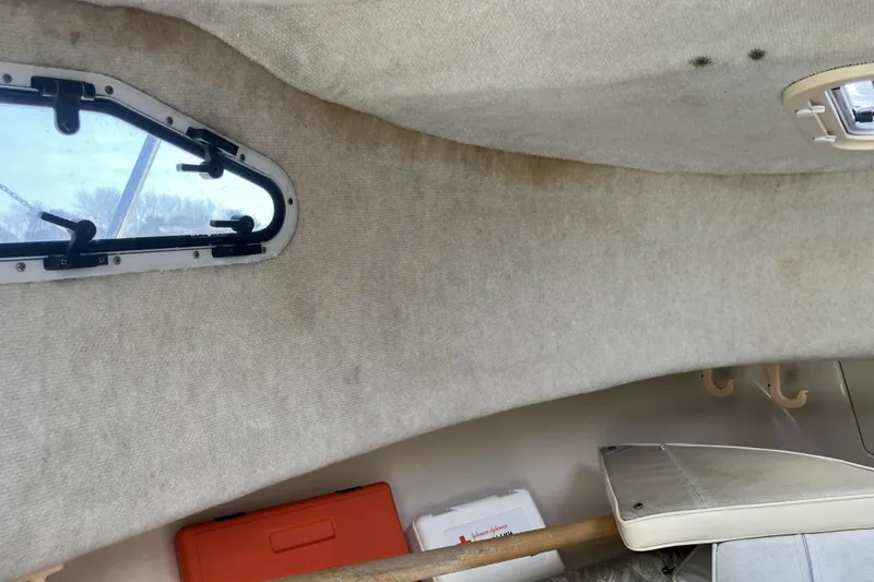 Slide: The Image of Interior cabin of 1998 Grady-White Seafarer 226 boat with window and storage. - 27