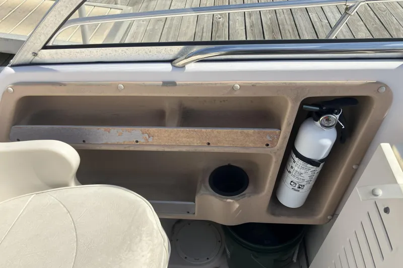 Slide: The Image of 1998 Grady-White Seafarer 226 boat interior with fire extinguisher and seating. - 29