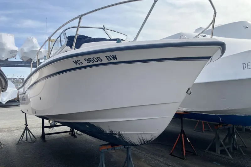Slide: The Image of 1998 Grady-White Seafarer 226 boat on stands, side view, outdoors. - 8