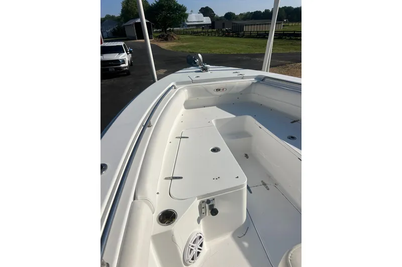 Slide: The Image of 2012 Sea Hunt Gamefish 27 boat deck, featuring spacious seating and storage compartments. - 3