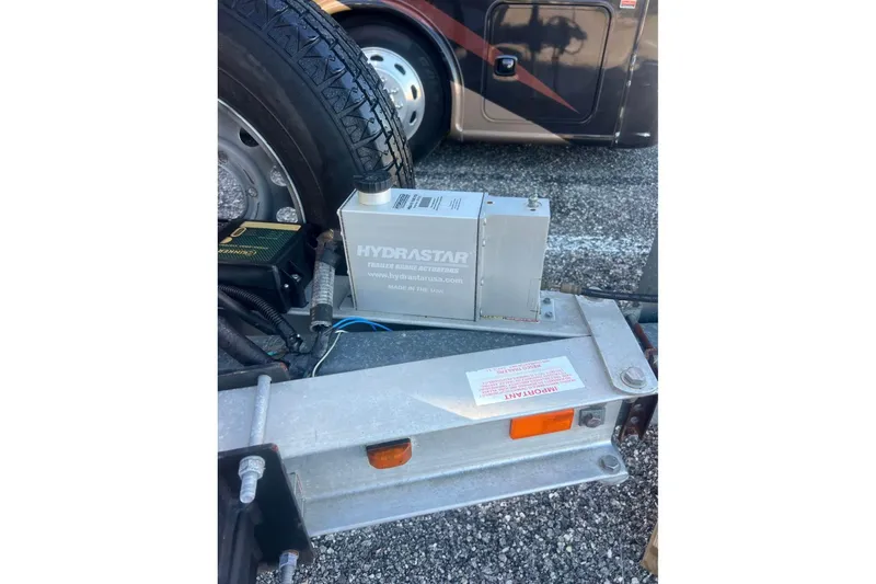 Slide: The Image of Trailer brake actuator on a 2012 Sea Hunt Gamefish 27, featuring Hydrastar system. - 6