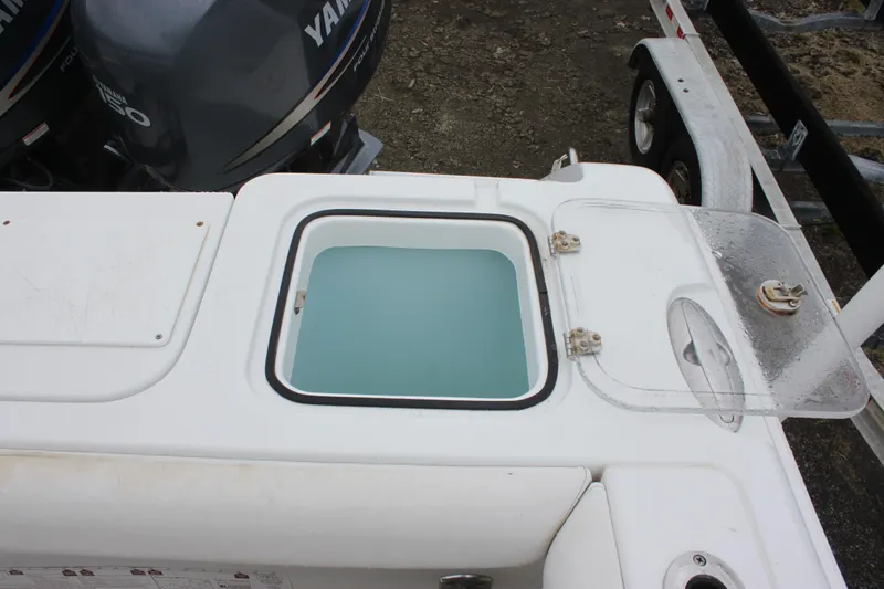 Slide: The Image of Interior of a 2012 Sea Hunt Gamefish 27 boat with toilet and NOCO Genius charger. - 15