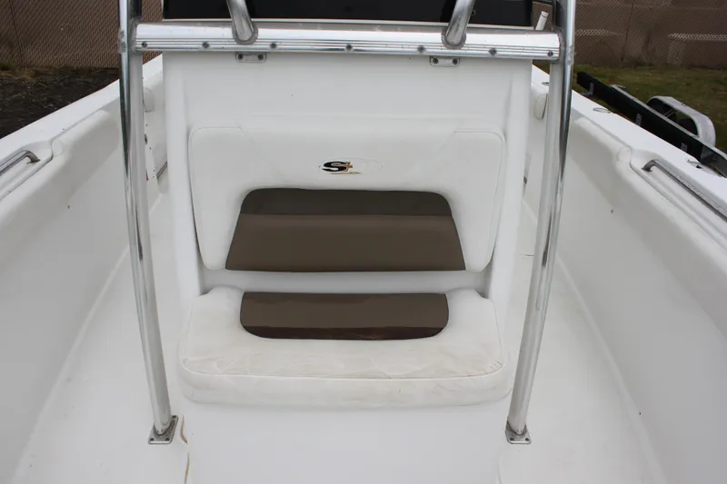 Slide: The Image of Interior view of a 2012 Sea Hunt Gamefish 27 boat with seating and coiled hose. - 17