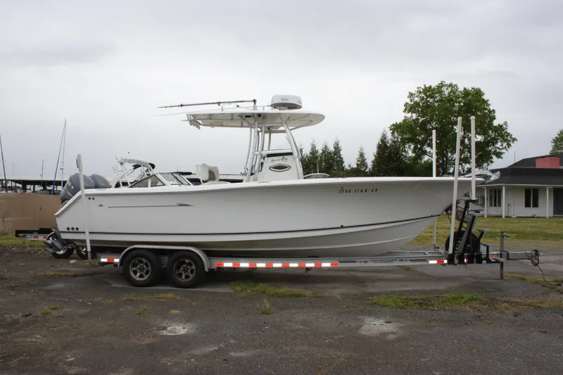 Slide: The Image of 2012 Sea Hunt Gamefish 27 livewell with Yamaha outboard engines in view. - 8