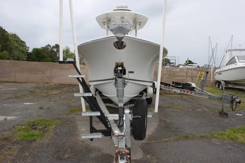Slide: The Image of 2012 Sea Hunt Gamefish 27 Forward Seating storage compartment, white interior view. - 9