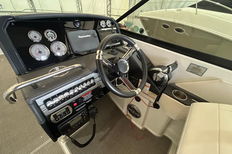 Slide: The Image of 2015 Formula 310 Bowrider dashboard with steering wheel and control panel. - 8