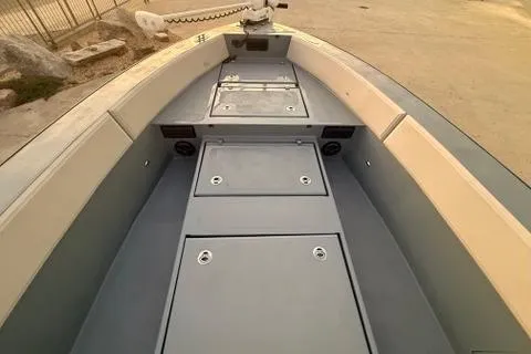 Slide: The Image of 2019 Metal Shark 28 CC boat interior with storage compartments and seating. - 22