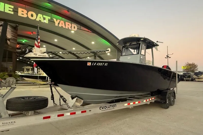 Slide: The Image of 2019 Metal Shark 28 CC boat on trailer at dealership, evening view. - 3