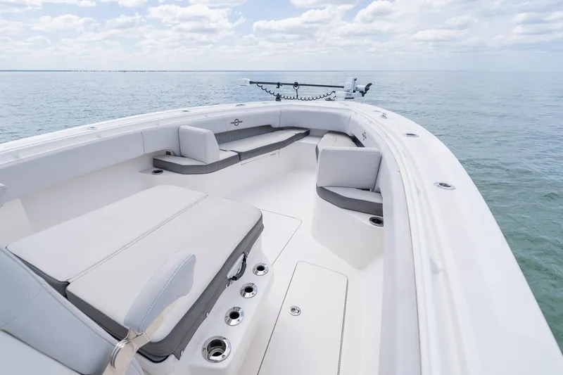 Slide: The Image of 2021 Fountain 38 Center Console boat interior with cushioned seating on open water. - 11