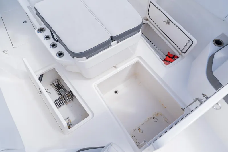 Slide: The Image of 2021 Fountain 38 Center Console boat interior with storage compartments and seating. - 12