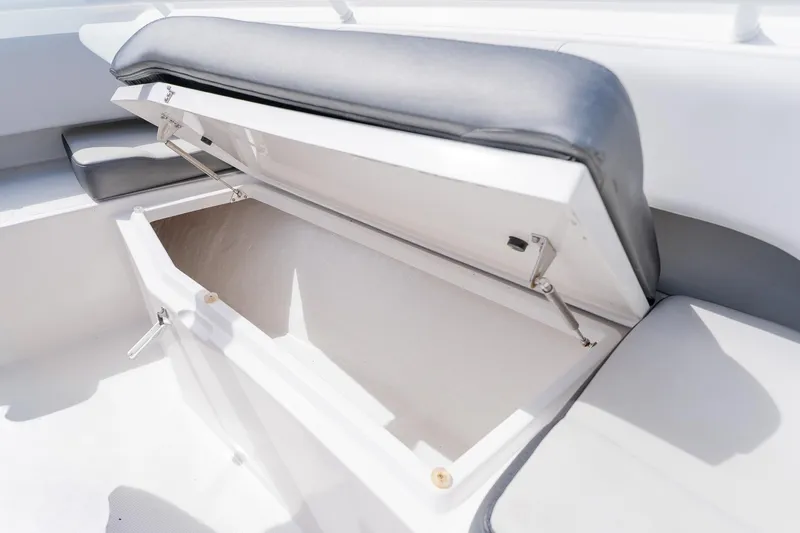 Slide: The Image of Open storage compartment on a 2021 Fountain 38 Center Console boat. - 15