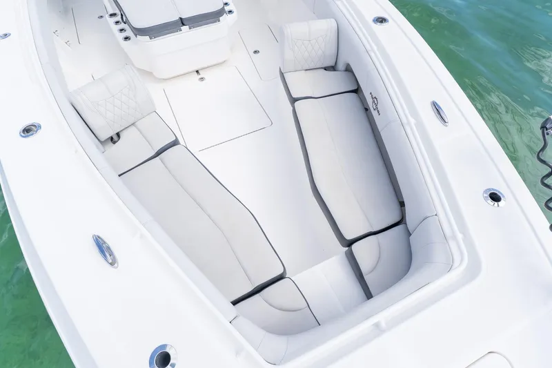 Slide: The Image of 2021 Fountain 38 Center Console boat interior with white cushioned seating. - 20
