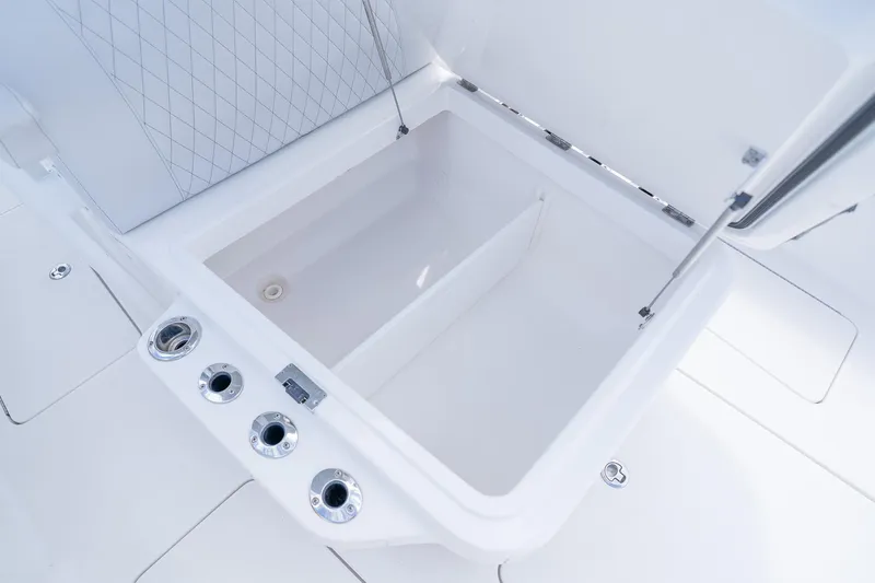 Slide: The Image of Open storage compartment on 2021 Fountain 38 Center Console boat. - 22