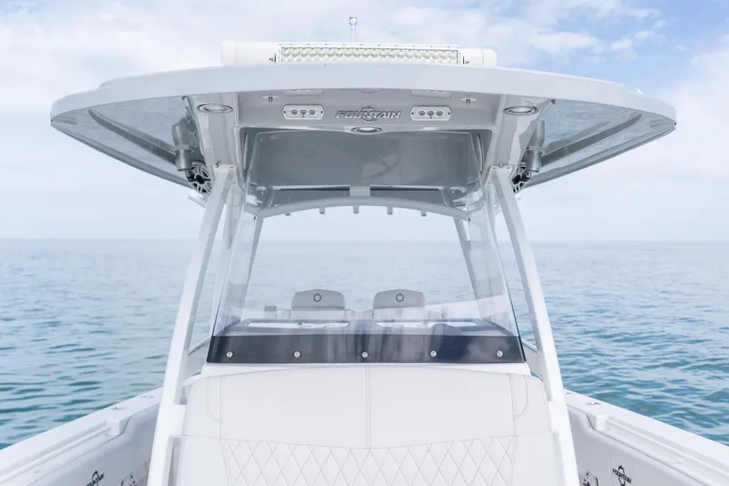 Slide: The Image of 2021 Fountain 38 Center Console boat on calm ocean waters. - 23