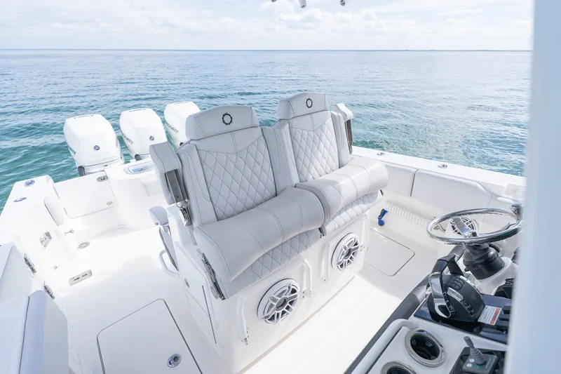 Slide: The Image of 2021 Fountain 38 Center Console boat interior with luxurious seating and ocean view. - 28