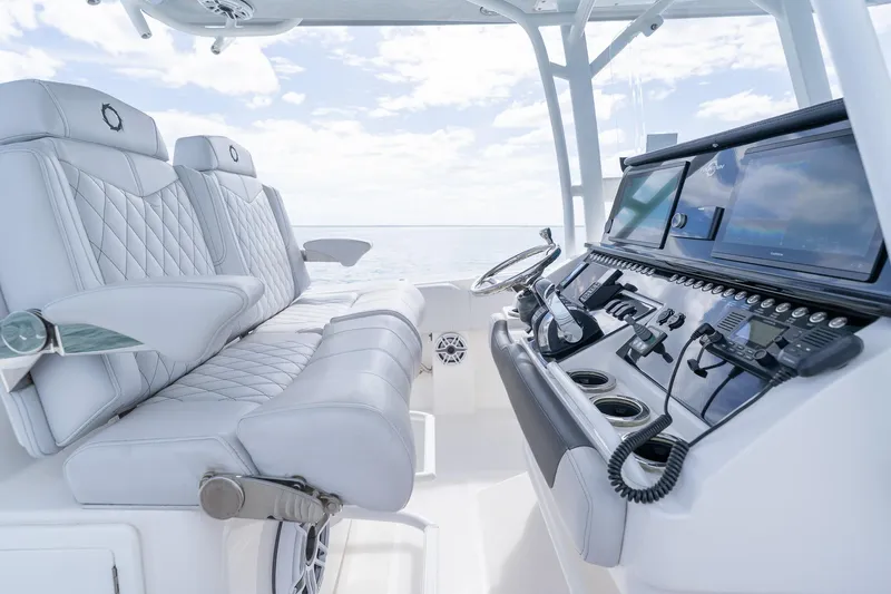 Slide: The Image of Luxurious interior of 2021 Fountain 38 Center Console boat with advanced navigation system. - 29