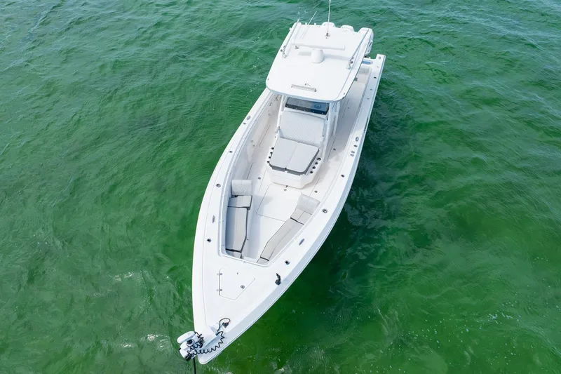 Slide: The Image of 2021 Fountain 38 Center Console boat on clear green water. - 3