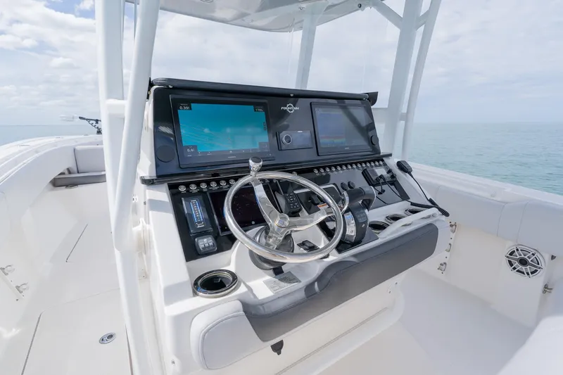 Slide: The Image of 2021 Fountain 38 Center Console boat dashboard with modern navigation equipment. - 32