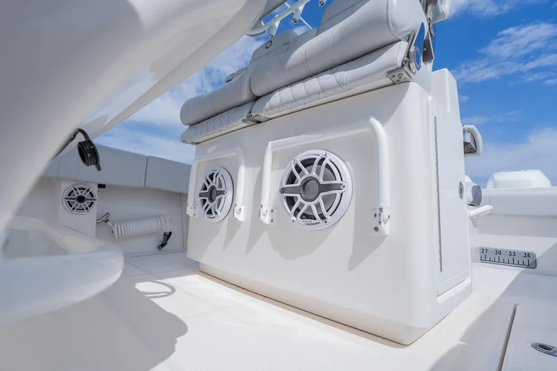 Slide: The Image of 2021 Fountain 38 Center Console boat interior with speakers and seating. - 37