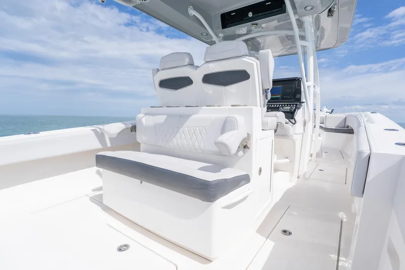 Slide: The Image of 2021 Fountain 38 Center Console boat interior with modern seating and navigation equipment. - 39