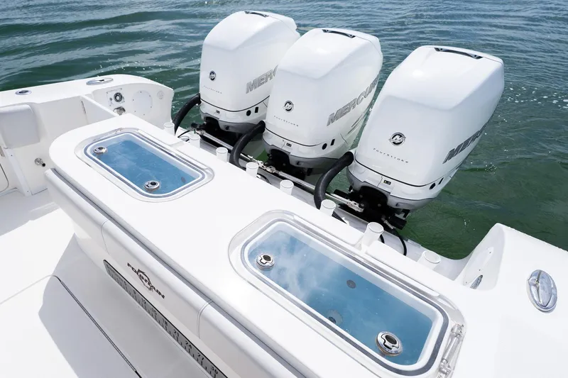 Slide: The Image of 2021 Fountain 38 Center Console with triple Mercury outboard engines on water. - 44
