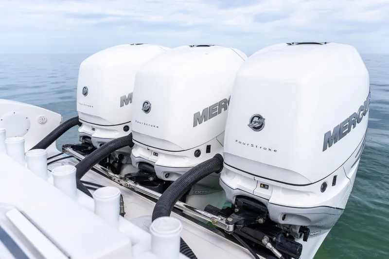 Slide: The Image of Triple Mercury outboard engines on a 2021 Fountain 38 Center Console boat. - 45