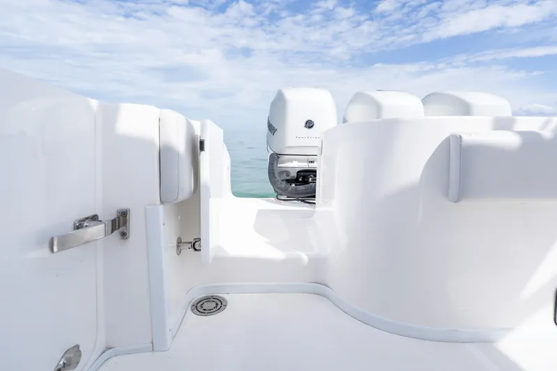 Slide: The Image of 2021 Fountain 38 Center Console boat interior with outboard motors and clear sky. - 46