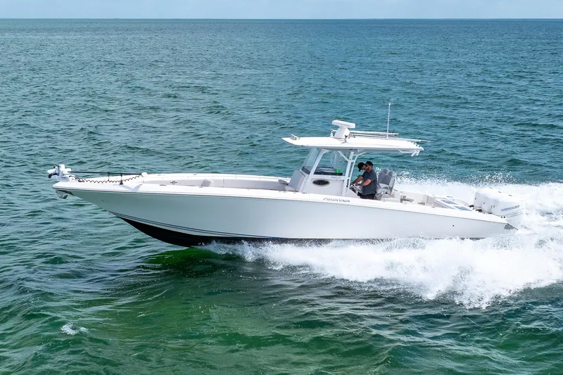 Slide: The Image of 2021 Fountain 38 Center Console boat cruising on open water. - 5
