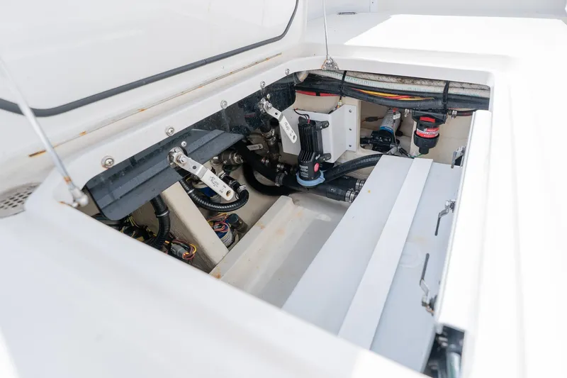 Slide: The Image of 2021 Fountain 38 Center Console engine compartment with visible wiring and components. - 50