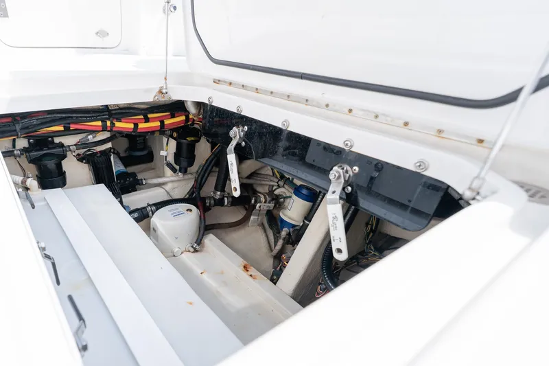 Slide: The Image of 2021 Fountain 38 Center Console engine compartment with visible wiring and components. - 51