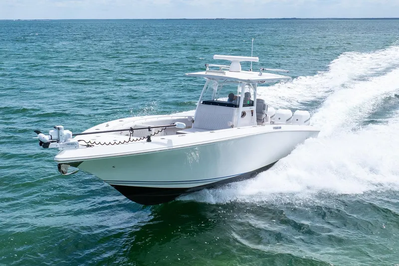 Slide: The Image of 2021 Fountain 38 Center Console boat cruising on open water. - 6