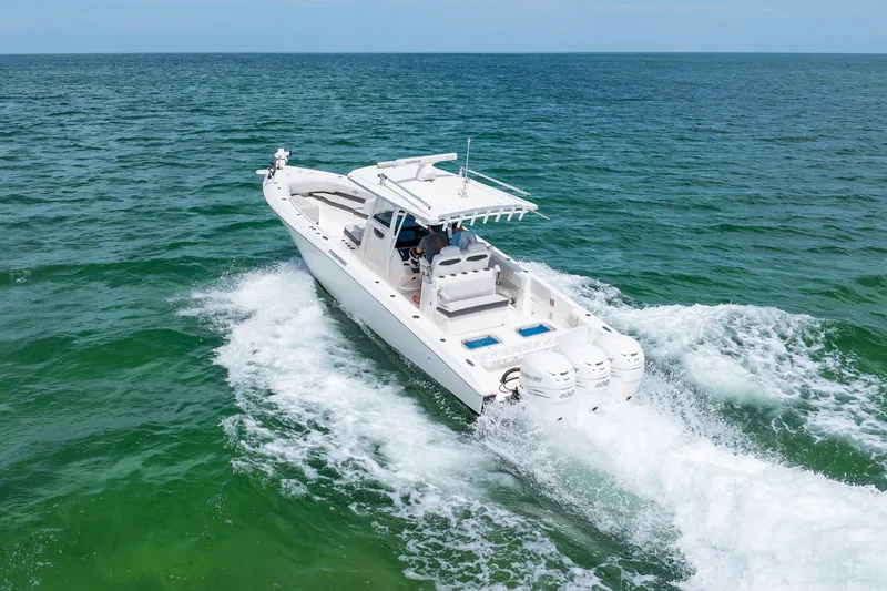 Slide: The Image of 2021 Fountain 38 Center Console boat cruising on open water. - 7