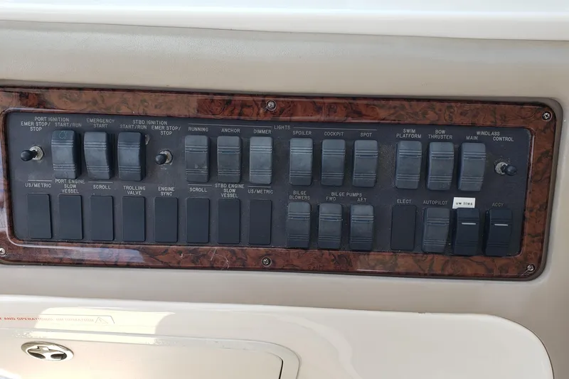 Slide: The Image of Control panel of a 2004 Sea Ray 550 Sundancer yacht with various switches. - 17