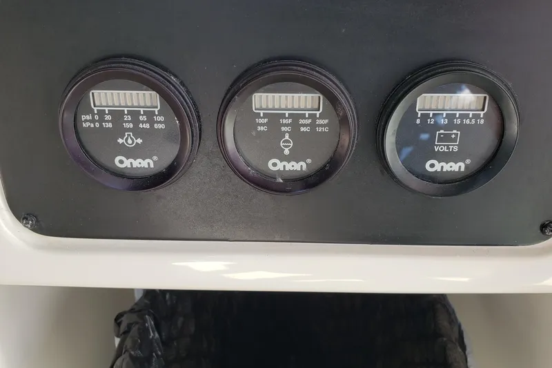 Slide: The Image of Instrument panel of a 2004 Sea Ray 550 Sundancer with Onan gauges. - 29